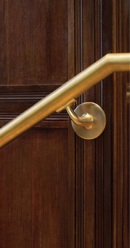 Interior bronze wall railing with handrail brackets at University of Pennsylvania